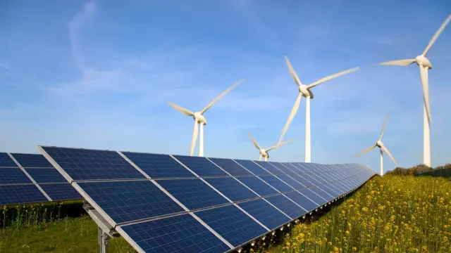 Solar panel and wind turbine. photo – Ecowatch