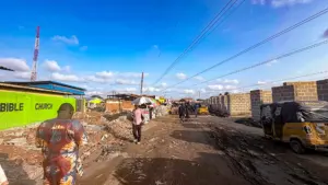 Ongoing construction of shops under the high tension wire yesterday. 	                  PHOTO: ENIOLA DANIEL