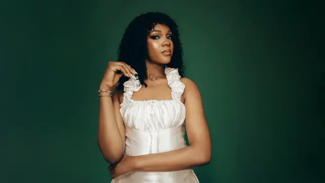 Young woman on curly wig