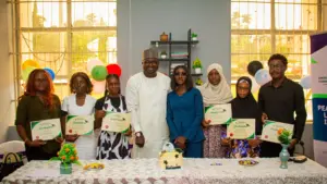 Executive Director of OIPCD, Amb. Honest Salihu Gode and Hon. Tpl Abubakar Ahmed Sadiq with a cross section of the graduating interns.
