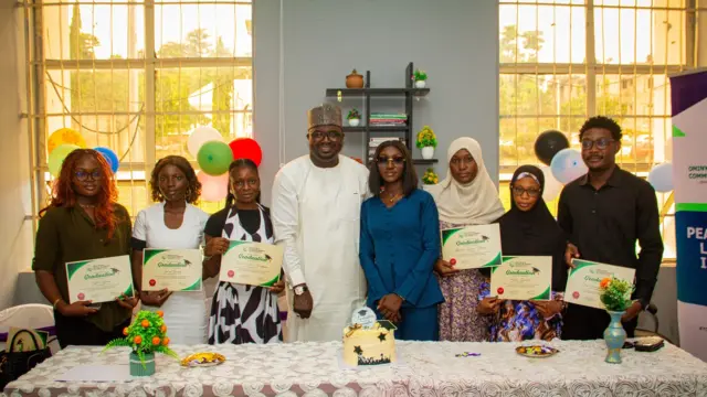Executive Director of OIPCD, Amb. Honest Salihu Gode and Hon. Tpl Abubakar Ahmed Sadiq with a cross section of the graduating interns.
