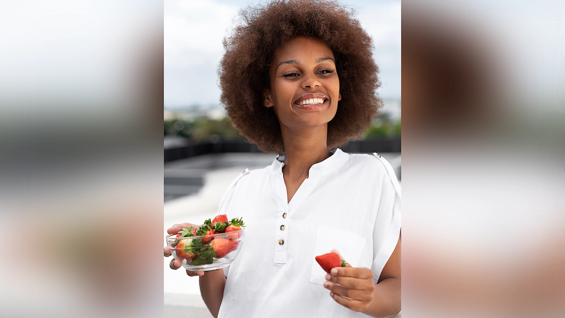 Young woman eating fruits