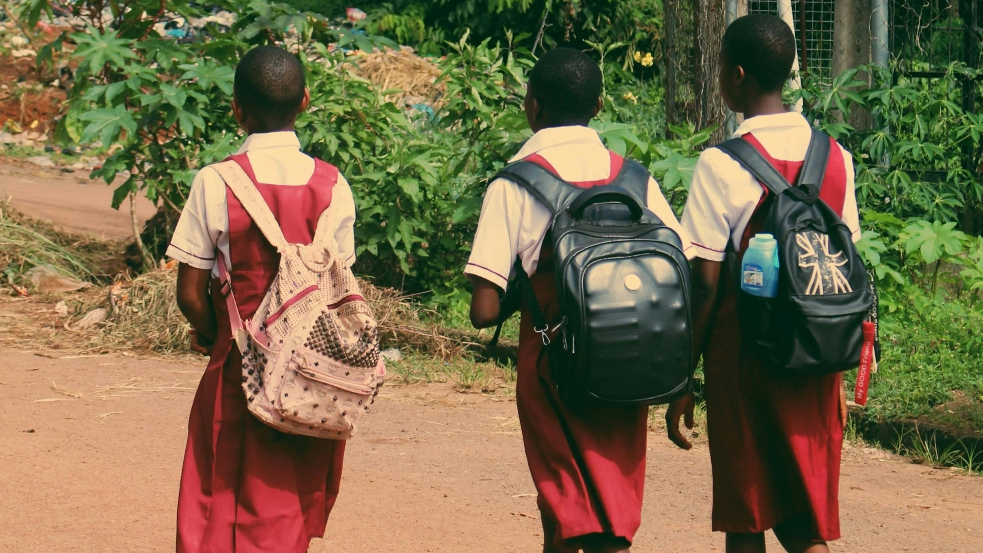 School children walking on a quiet street in Nigeria