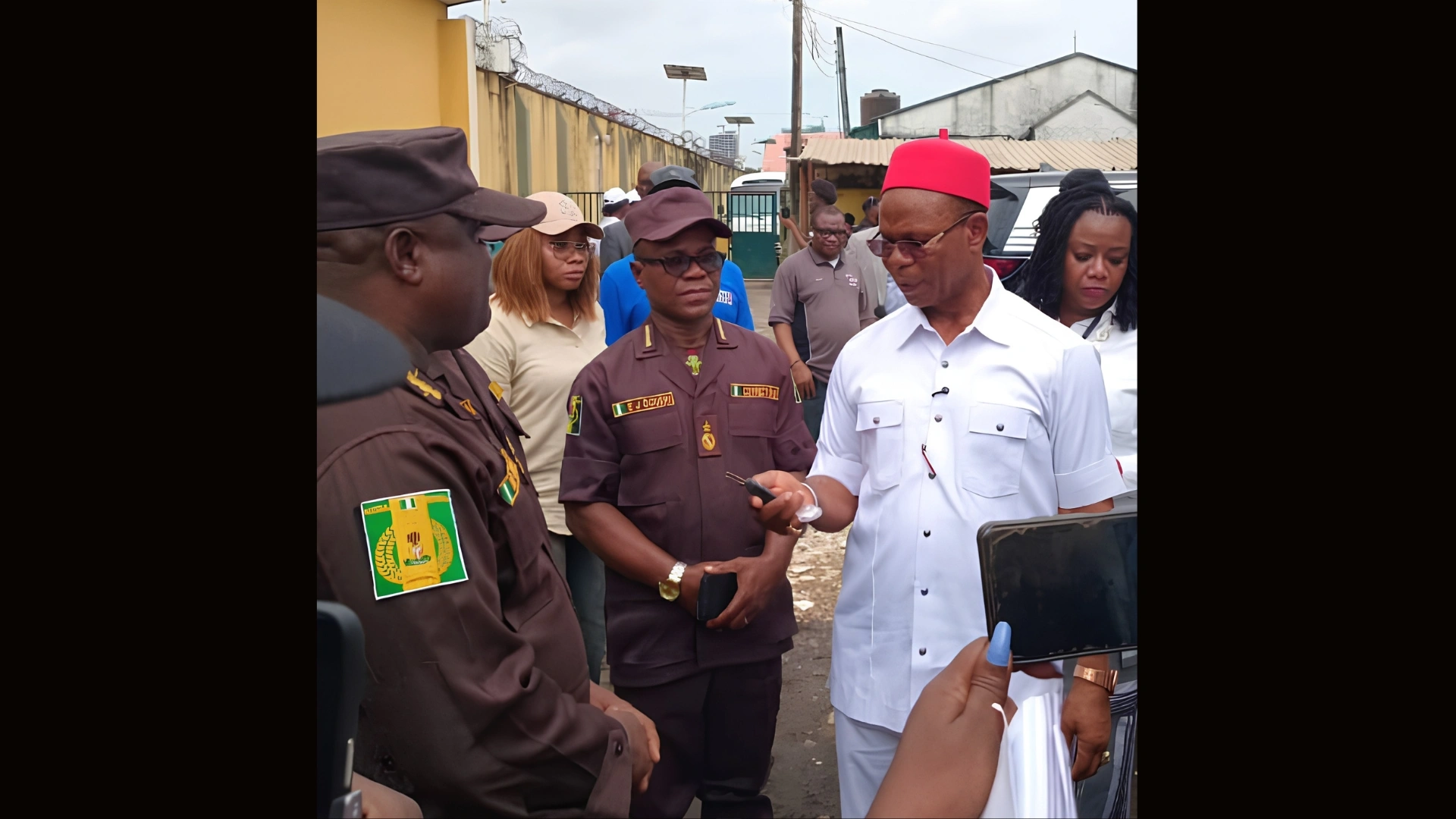 Founder and CEO of Chisco Group Nigeria Limited, Chief Chidi Anyaegbu, hands over the keys to the buses to Assistant Controller-General of Corrections in charge of Zone A, Raphael Ogaba Unazi, while Officer in Charge of the Ikoyi Medium Security Custodial Centre, Julius Ogueri, looks on during the presentation of two Mercedes-Benz buses to the Medium Security Custodial Centre, Ikoyi, Lagos.