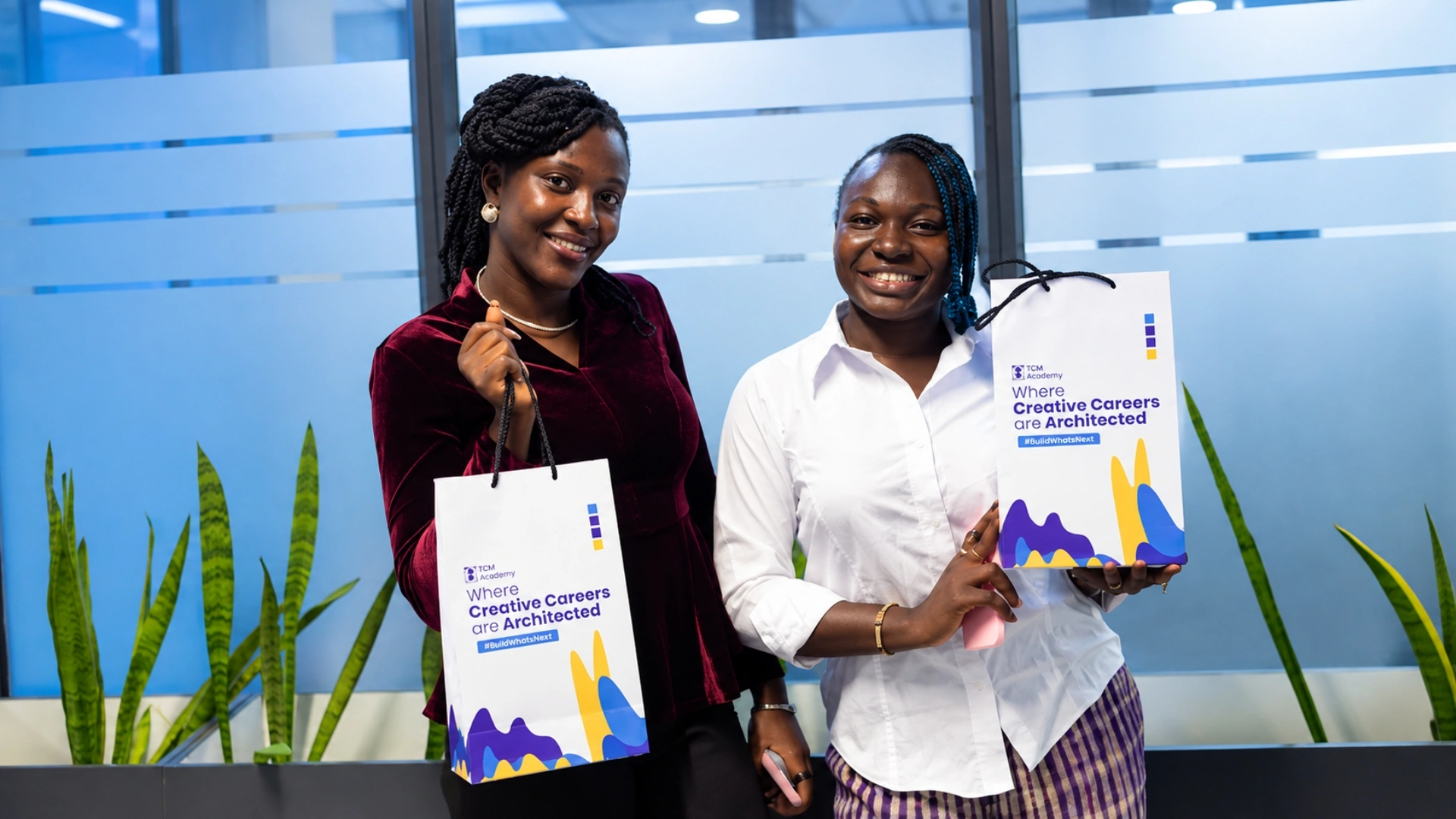 Cover Image of 2 students holding TGM Academy bags