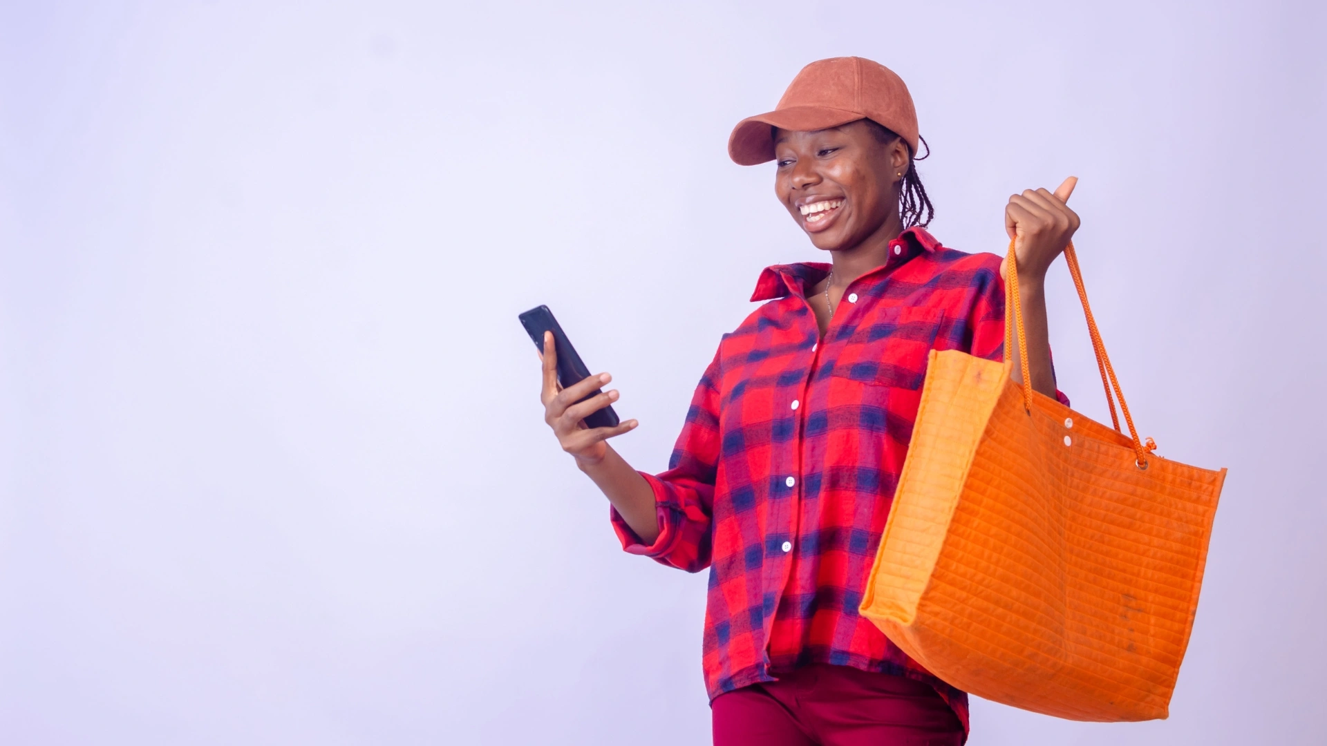 Happy woman shopping with smartphone