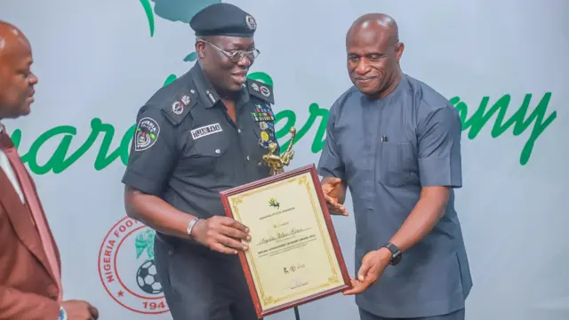 Nigeria Pitch Awards President, Shina Philips (right), presenting the Special Achievement in Sports Award to representative of the Lagos Commissioner of Police, Fatai Tijani, at the awards ceremony, recently.