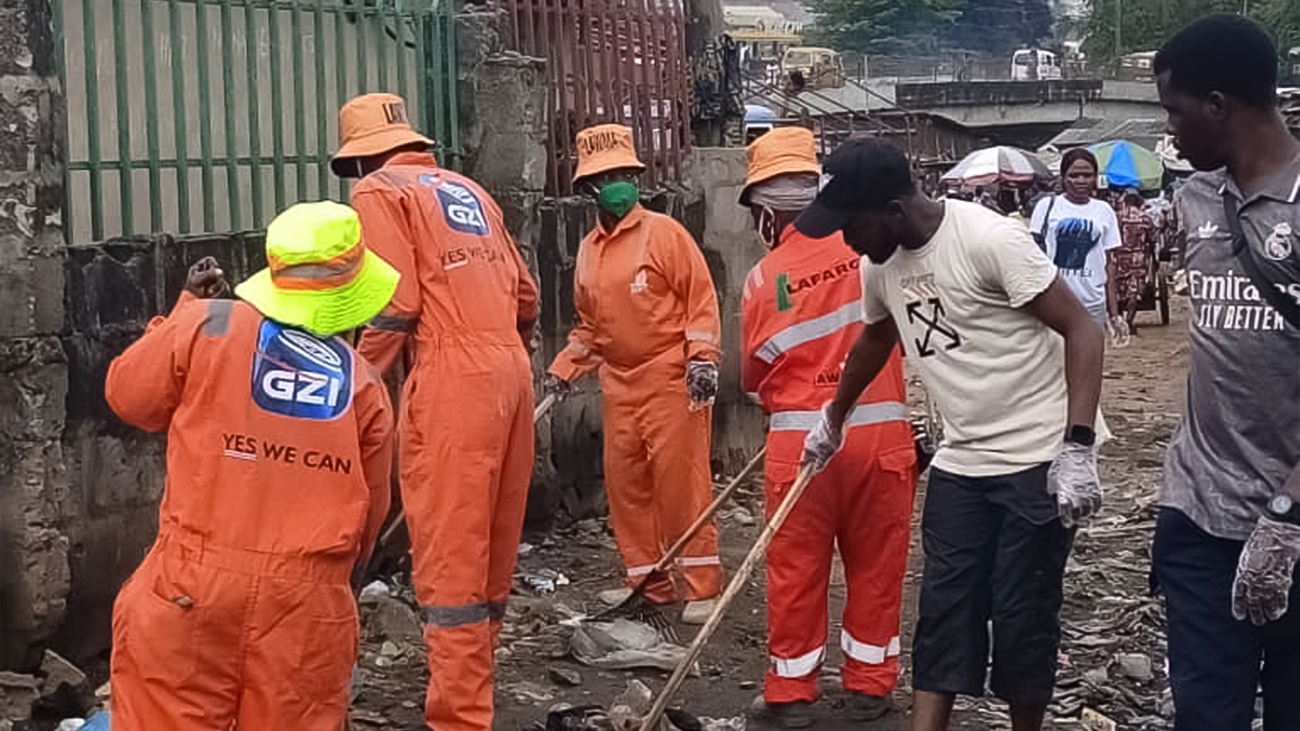 LAWMA officials during sanitation activities at Igando Market.