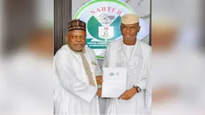 Registrar/CEO, NABTEB, Dr. Mohammed Aminu Mohammed and President, ITPN, Chief Abiodun Odusanwo, displaying the signed MoU document.