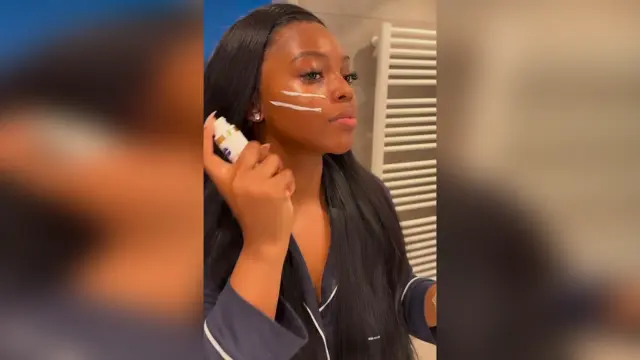 A lady using beauty product