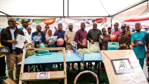 LSSTF Chairman, Wahid Enitan Oshodi (seventh left), Lagos State Commissioner for Youth and Social Development, Mobolaji Ogunlende (middle), members of the LSSTF and government officials at the distribution of the equipment to 57 councils in Lagos, yesterday.
