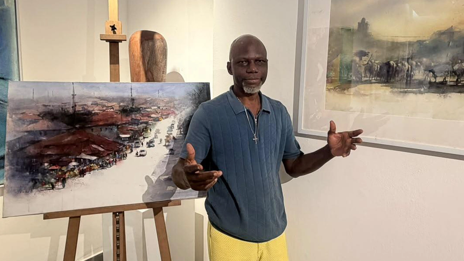 Sola Olumuyiwa standing in between Urban Dilemma and Home Coming