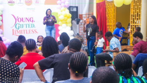 Camp Director, Idara Uwatt addressing the crowd of children and some parents at the camp grounds.