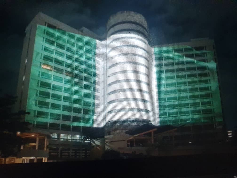 The iconic Federal Palace Tower bathed in Nigeria's white and green national colours in celebration of the country's 66th independence.
