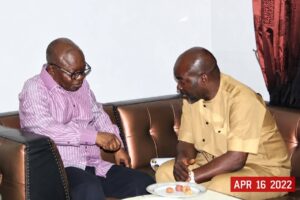 Former Delta State Governor, Emmanuel Eweta Uduaghan (LEFT) in a chat with Deacon Chris Iyovwaye