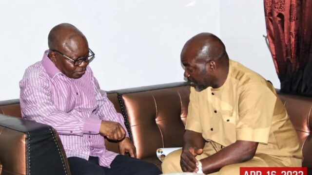 Former Delta State Governor, Emmanuel Eweta Uduaghan (LEFT) in a chat with Deacon Chris Iyovwaye