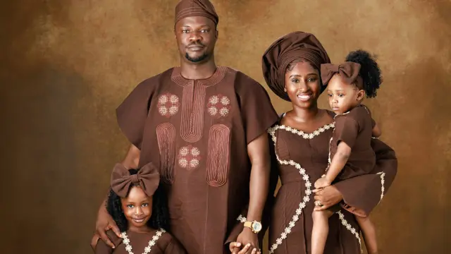 Late gospel singer Toluwanisings with his wife and children