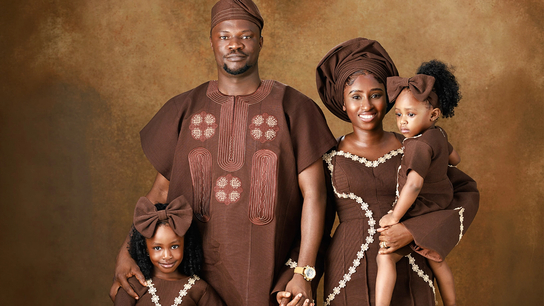 Late gospel singer Toluwanisings with his wife and children