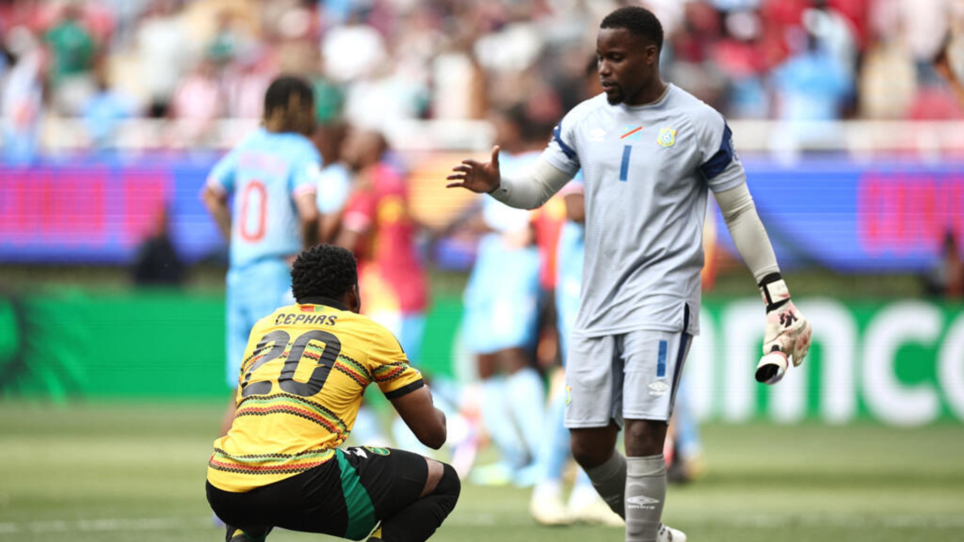 Lionel Mpasi walks up to a Jamaican player after DR Congo's victory in the 2026 World Cup playoffs. 
