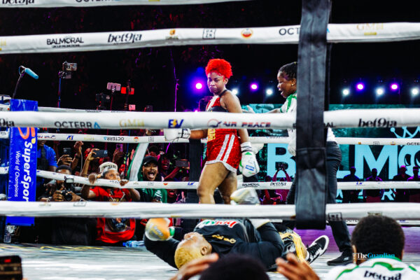 Phyna after knocking Nkechi Blessing (on the canvas) out in the fourth round at “Chaos in the Ring” in Lagos. Photo by Oluwabukunmi Fakanbi