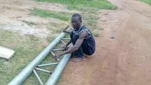 Suspect with vandalised iron pole.
