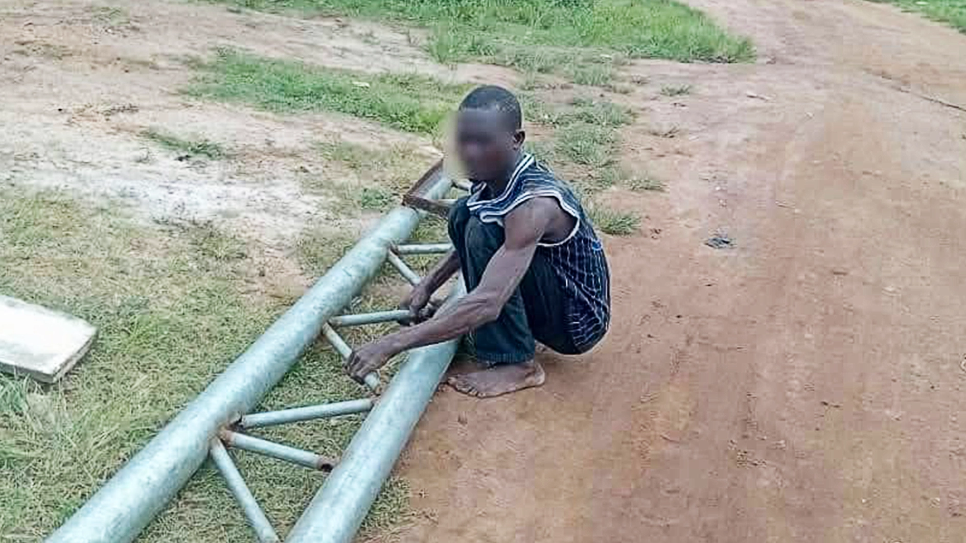 Suspect with vandalised iron pole.