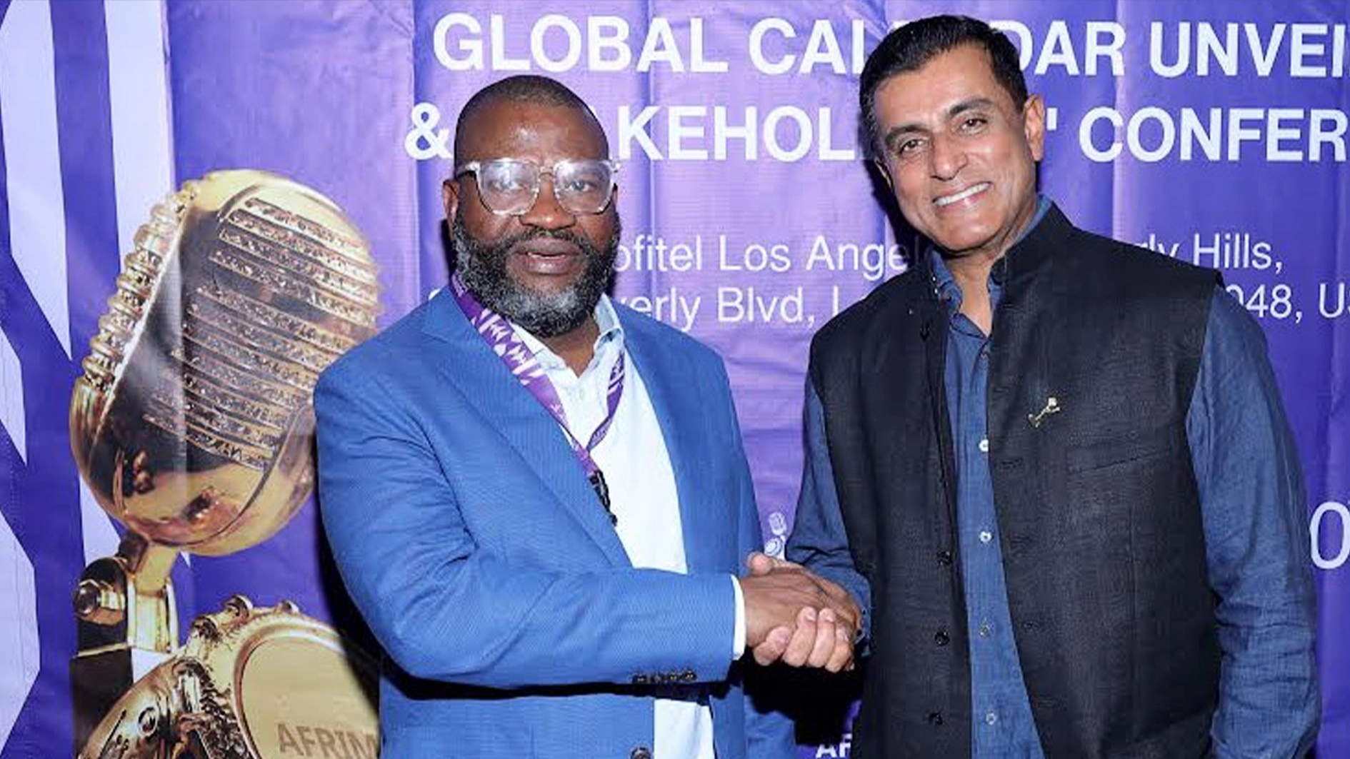 AFRIMA President and Executive Producer, Mike Dada, and Narendra Reddy, Chief Operating Officer, The Africa Channel at the AFRIMA Global Calendar Unveiling & Stakeholders Conference in Los Angeles, California.  (Photo by Arnold Turner/Getty Images for AFRIMA