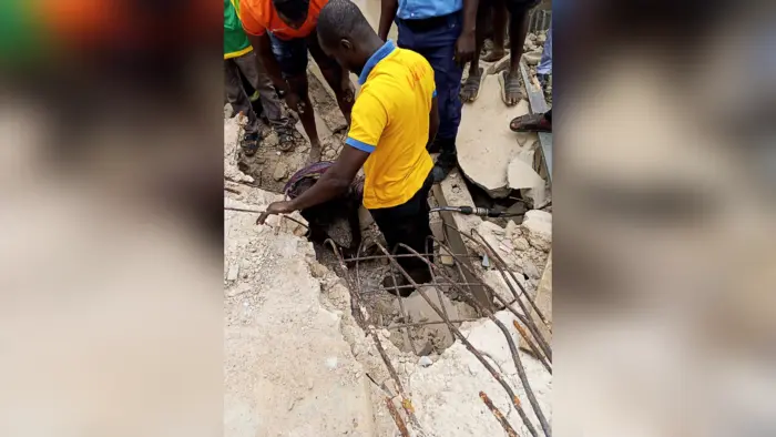 Rescuers extricating the trapped victim